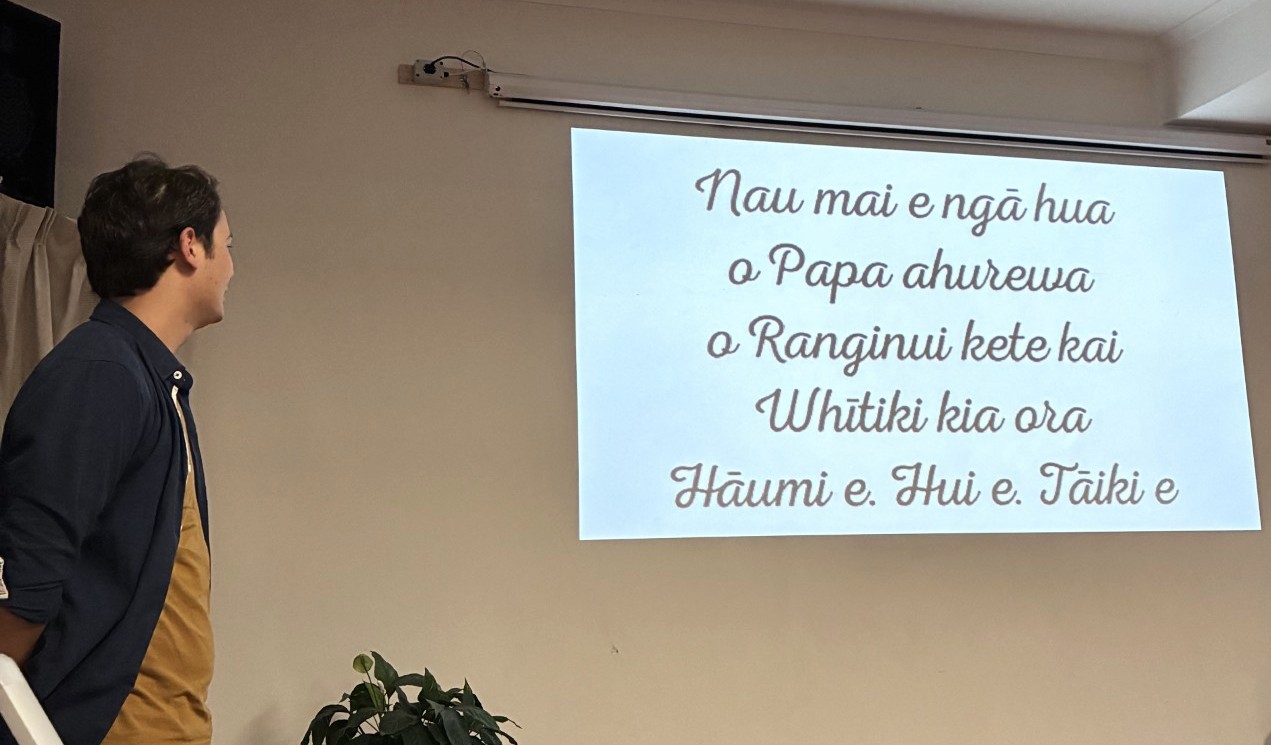 Man reads tre reo lyrics for CWEA Matariki Celebration